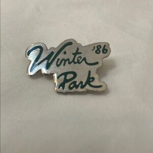 Winter Park '86 Silver and Green Pin